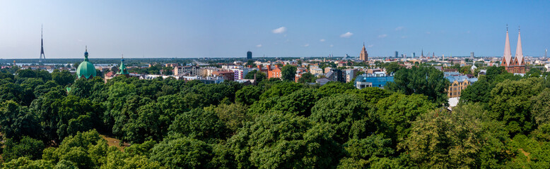 Fototapeta na wymiar Beautiful aerial view of the Riga city from above. Old town by the river Daugava.