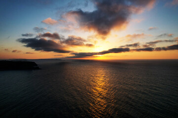 Fototapeta premium In this photo you can see the Cantabrian Sea from Galizano beach and its orange rock cliffs. This town is located north of Cantabria, in Spain.
