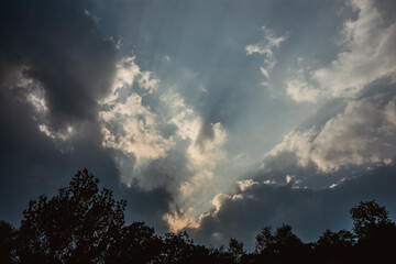 clouds and sunrays in the sky