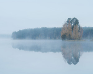Autumn foggy morning on a lake