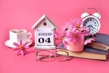 Calendar for August 4 : the name of the month of August in English, the numbers 0 4, a cup of tea, books, a bouquet of pink flowers, glasses for vision, an alarm clock on a pink background
