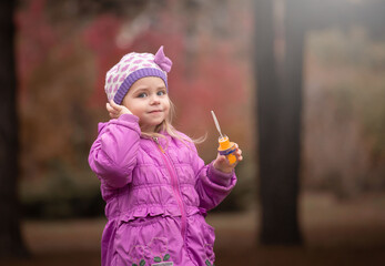 Girl, garden, lilac coat, soap bubble blower