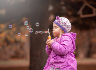 Girl, garden, lilac coat, soap bubble blower