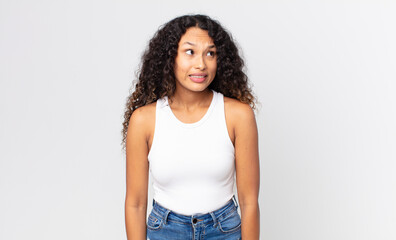 pretty hispanic woman looking worried, stressed, anxious and scared, panicking and clenching teeth