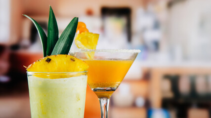 gooseberry cocktail with pilla decoration and pineapple cocktail in a glass, in a bar or restaurant