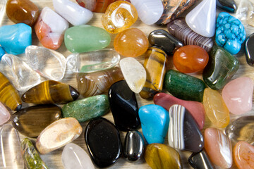 Collection Of Semi-Precious Gemstones on wooden bamboo board