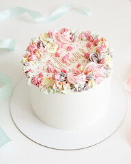 Fototapeta na wymiar Cake for mom is decorated with cream flowers