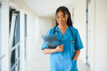 beautiful african american female pediatric nurse in modern office