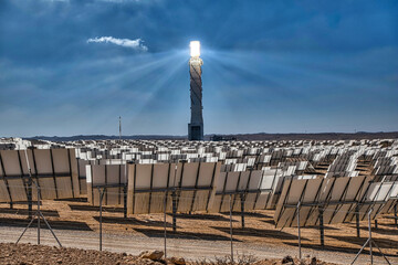 Concentrated solar power plant with mirrors focusing the sun energy at the steam turbine tower.