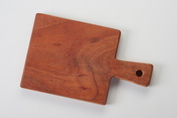 Empty wooden cutting board on table