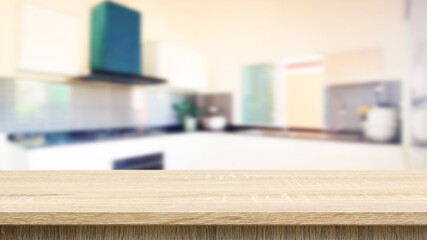 Empty wood table top on blurred kitchen counter background - can be used for display or product display concept.