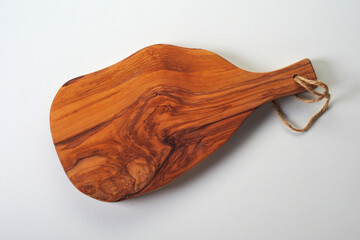 Rustic wooden serving board on white background