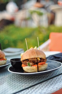 A Picture Of A Burger With Crispy Chicken Crumb Patty