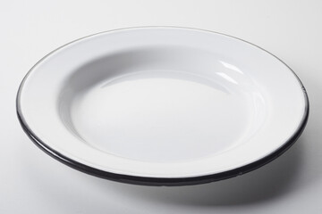 White enameled plate with black rim