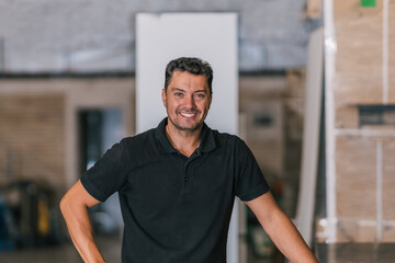 Fototapeta premium Portrait of a worker in a furniture workshop