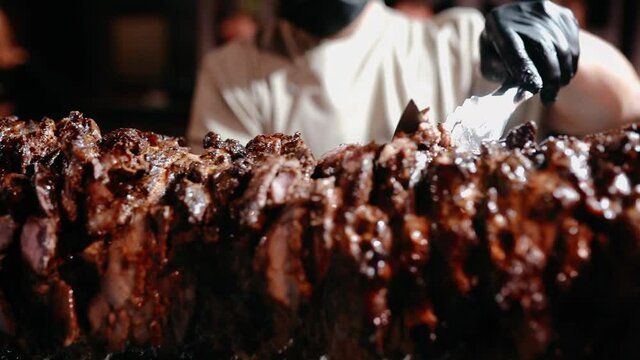 Turkish doner, kebab Istanbul lunch. Grilled chicken. Chef prepares juicy kebab and doner in a Turkish restaurant. High quality FullHD footage