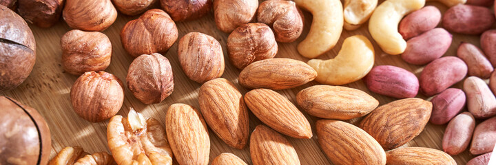 Different nuts. Home kitchen. Protein and fat food. Mix seeds. Raw whole snack. Munchies. Natural cuisine. Vegan. Peanut, almond, macadamia, pecan, cashew