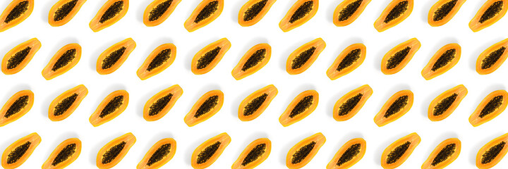 Fresh ripe papaya background on white backdrop. Modern tropical abstract background. Top view. Creative design, minimal flat lay concept. Trend tropical fruit food background - not seamless pattern