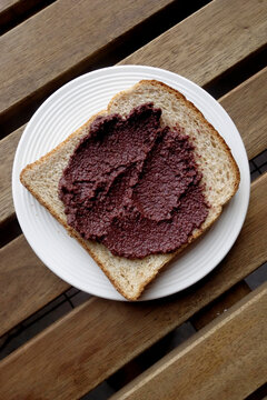 Delicious Olive Paste On A Slice  Of Whole Wheat Brown Bread