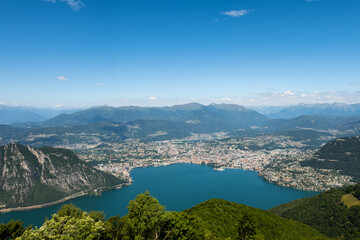 Naklejka na ściany i meble Gorgeous view from the hill top at Balcony of Italy, over Lake Lugano, city Lugano and other cities. The view go far into Switzerland, all to the way to the Swiss alps. Shot from the Italian side of t