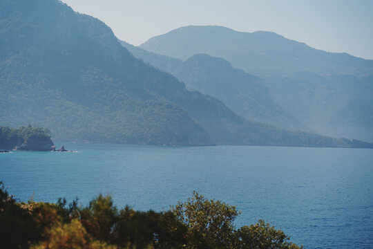 Beautiful Landscape, Blue Mountain Hills In The Fog On The Beach