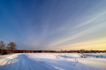 Snow covered road or skiing on a winter sunny day.
