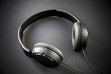 Fototapeta na wymiar Headphones on a black background