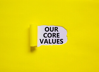 Our core values symbol. Words 'Our core values' appearing behind torn yellow paper. Beautiful...