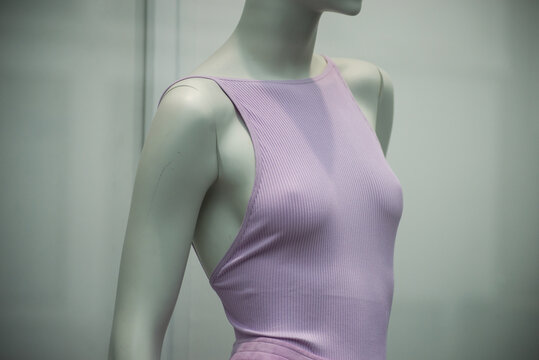 Closeup of purple top on mannequin in a fashion store showroom