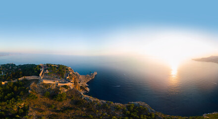 Large panorama. Wide aerial view from Kalesi Castle peninsula. Alanya, southern coast of Turkey, Summer sunset. Travel and vacation. Ships and boats in the sea. Cleopatra beach and lake. Copy space