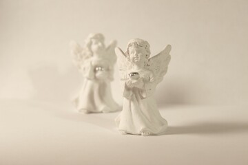 two white angels in a dress