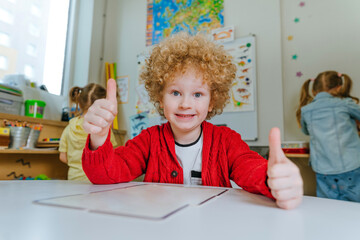 Little boy preschool student playing in kindergarten