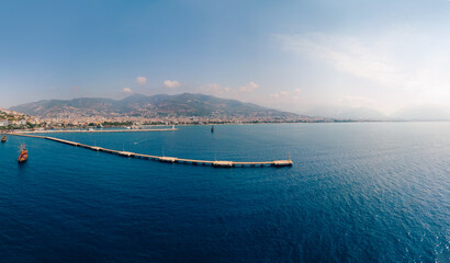 Fototapeta na wymiar Aerial wide view of Alanya Turkey, Summer morning. Travel and vacation. Ships and boats. Kızılkule bay. lighthouse and pier. Copy space Show program and entertainment for tourists, swimming
