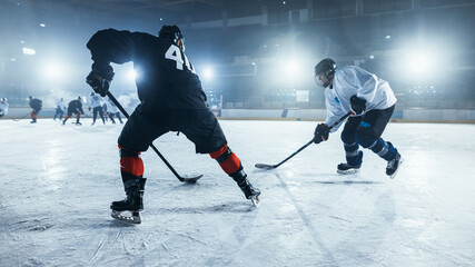 Ice Hockey Rink Arena: Young Players Training, Learning Stick and Puck Handling. Athletes Learn how...