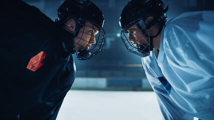 Ice Hockey Rink Arena Game Start: Two Professional Players Aggressive Face off, Sticks Ready. Intense Competitive Game Wide of Brutal Energy, Speed, Power, Professionalism. Close-up Portrait Shot - obrazy, fototapety, plakaty