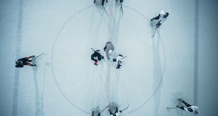 Top View Ice Hockey Rink Arena Game Start: Two Players Face off, Sticks Ready, Referee Ready to...