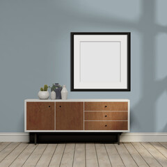 Contemporary living space with wood cabinet, wood floors, blue walls and empty frame for mockup