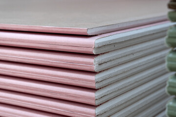 Close-up of The stack of Plasterboard fire resistant gypsum board cardboard surface Panel