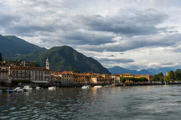 Early evening view over lake Como and the town of Menaggio. Beautiful view over lake and town, during the early evening just before sunset. It is an overcast, but still nice evening.