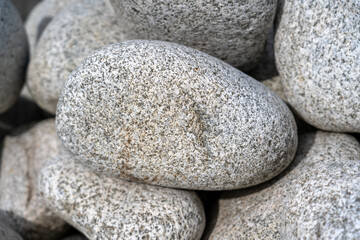 Fototapeta na wymiar Large Gray Granite Pebbles Background