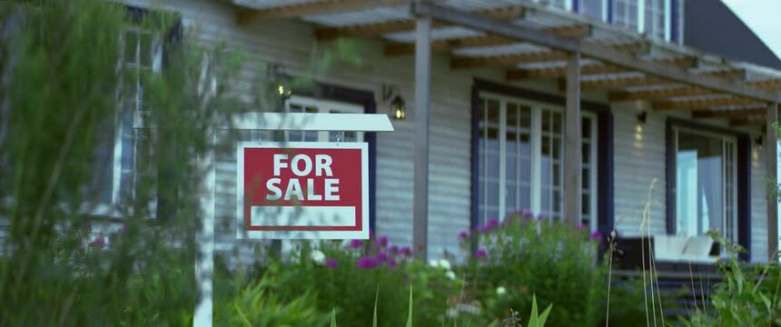 FOCUS RACK For sale sign standing on a lawn in front of an American style house. Shot with 2x anamorphic lens