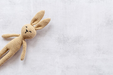 Knitted toy easter bunny for newborn baby or baby shower