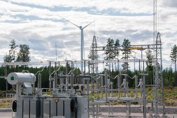 Power plant with wind turbines in background
