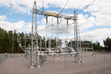 Power plant with wind turbines in background