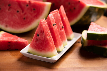 Fresh slices red watermelon on plate.
