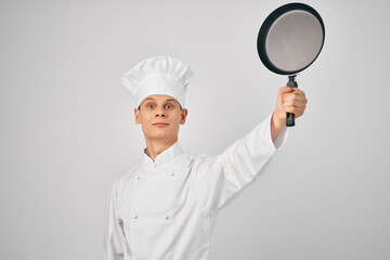 chef with a frying pan in hand kitchen service staff