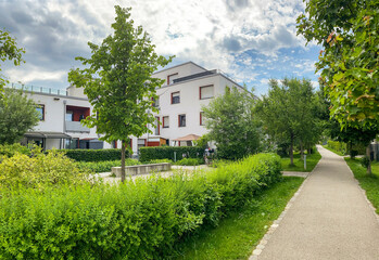 Residential area with ecological and sustainable green residential buildings, low-energy houses with apartments and green courtyard - 448832008