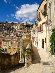 Fototapeta na wymiar Ragusa houses seen form a narrow street of Ragusa Ibla
