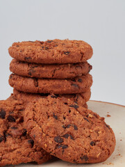 Homemade oatmeal cookies folded in a pile on the old table