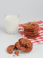 Homemade oatmeal cookies folded in a pile on the old table